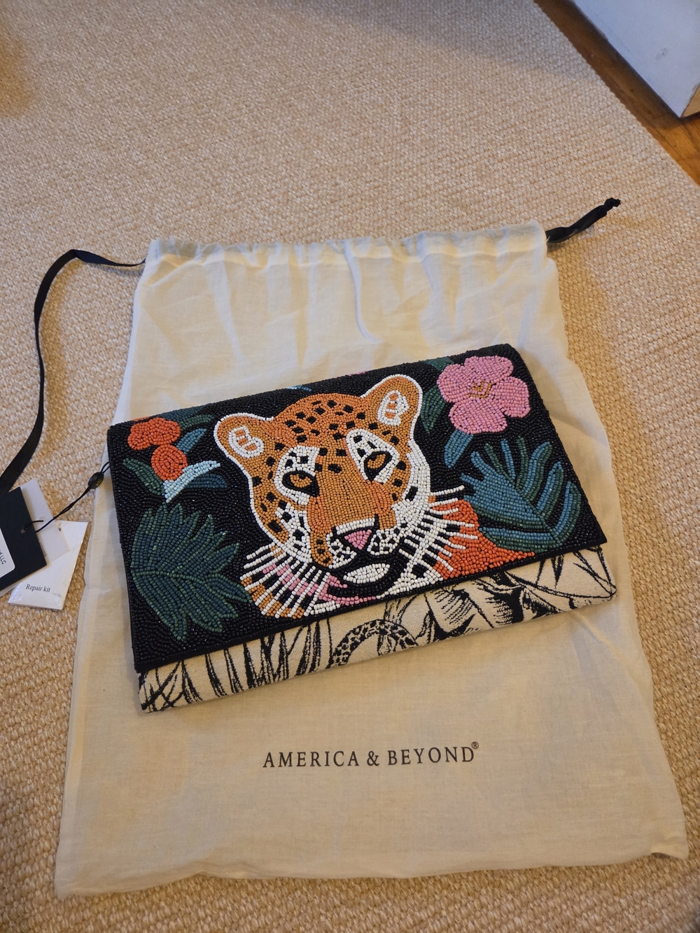 America & Beyond Black Beaded Tiger Clutch with Floral Accents